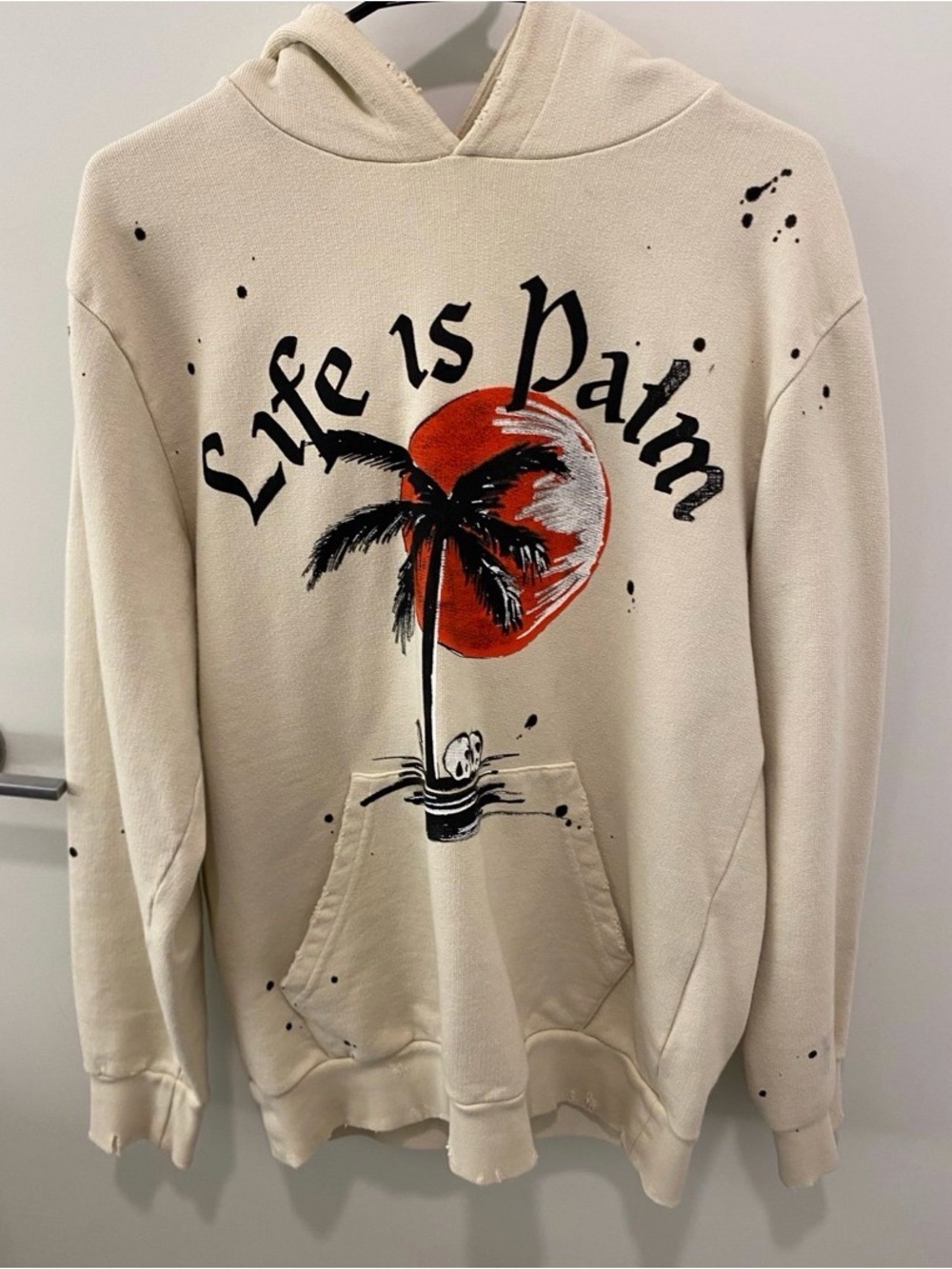 Palm Angels 'Life is Palm' Paint Splatter Cream Hoodie with Black & Red Graphic